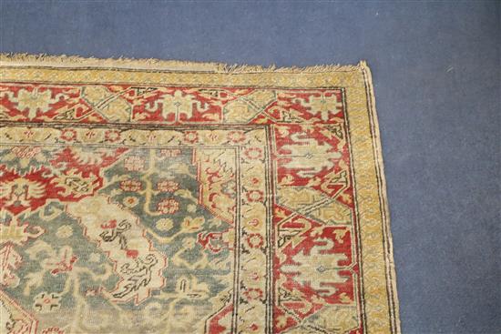 A Turkish blue ground rug, 6ft 5in by 4ft 5in.